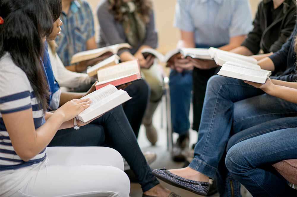 Small group reading the Bible together